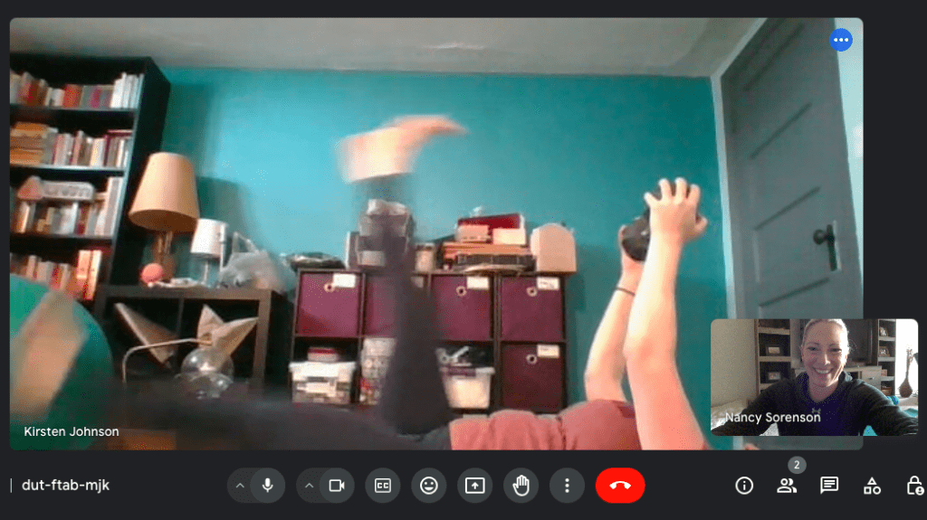 Virtual personal trainer and client during an online training session